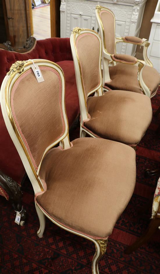 A cream and gilt decorated fauteuil and a pair of matching salon chairs